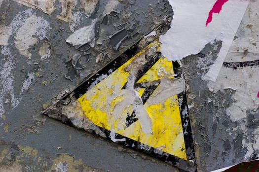 Grunge warning sign of High Power under layer of old wallpapers