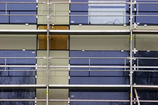 Detail of scaffolding platform infront of new house facade