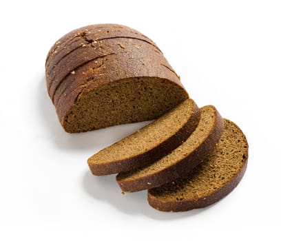 Sliced brown rye bread with shadow on white background. Clipping path included.