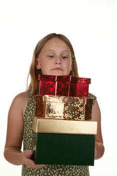 girl struggling to carry lots of presents