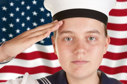 young female sailor saluting in front of US flag