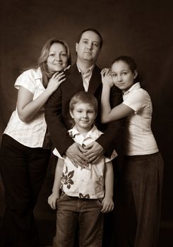 Portrait of parents and children in studio