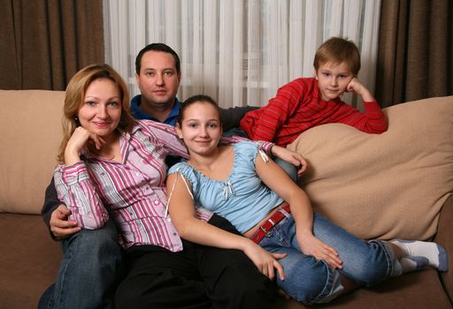 Portrait of parents and children at home