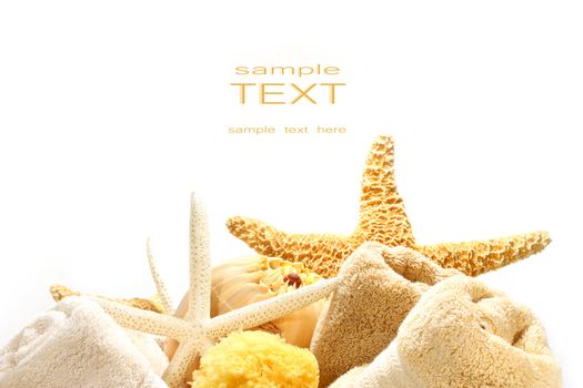 Assorted towels and starfish against a white background