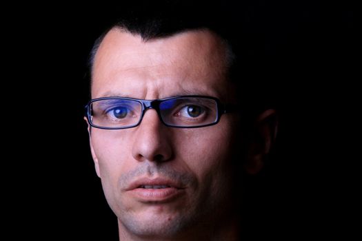 young man over black background