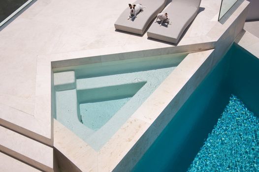 Custom Luxury Pool and Chairs Abstract with two JRTs relaxing.