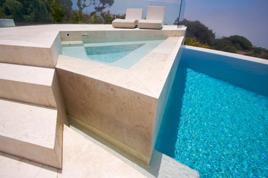 Custom Luxury Pool, Hot Tub and Chairs Abstract with Coastal Clouds Rising in Background.