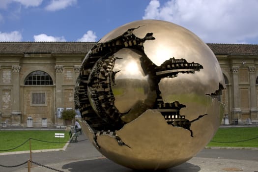 Golden ball in Rome symbol Vatican over blue sky