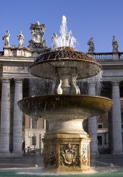 Beautiful fountain near Vatican over blue sky