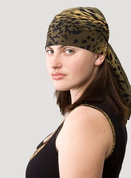 girl in kerchief on a grey background