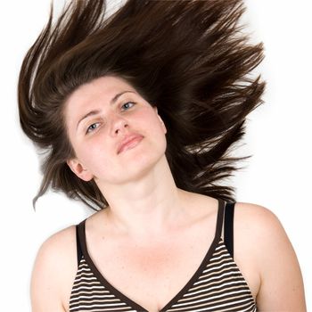 girl with fluttering hair on a white background