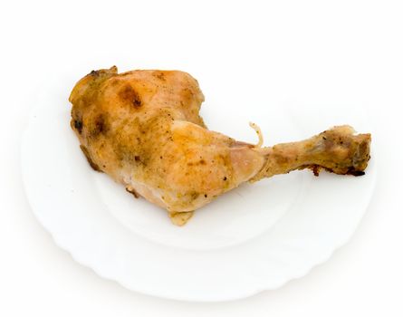 The fried part of a chicken on a white plate