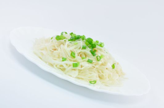 Sauerkraut with Spring Onions on White Plate