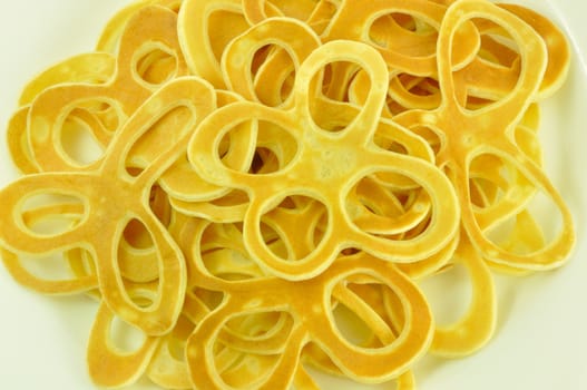 Pancake Flowers Fried from Batter, on White, Close-Up