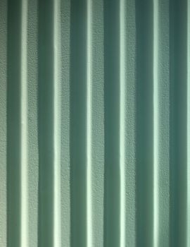 Reflecting color on green wall