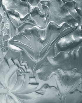 Wall decorated with flowers. Bas-relief