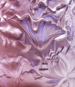 Wall decorated with flowers. Bas-relief
