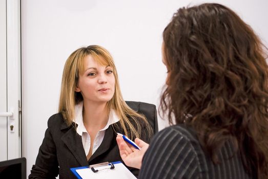 young woman being interviewed for a job