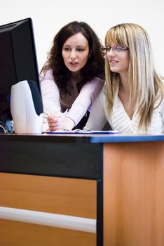 two attractive colleagues working as a team