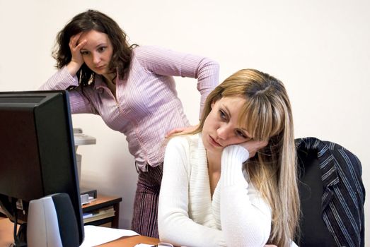 two attractive colleagues being in deadlock at work