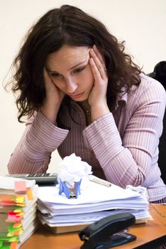 young businesswoman looking pile of documents and sheets