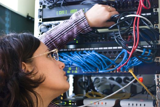 young woman repairs computer hardware