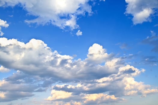 Background of blue sky with white cumulus clouds
