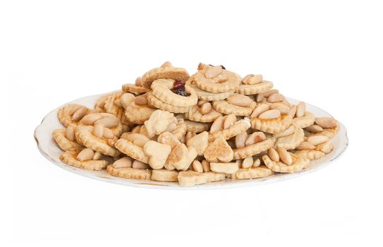 a plate with homemade almond pastries isolated on white background