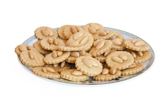 a plate with homemade almond pastries isolated on white background