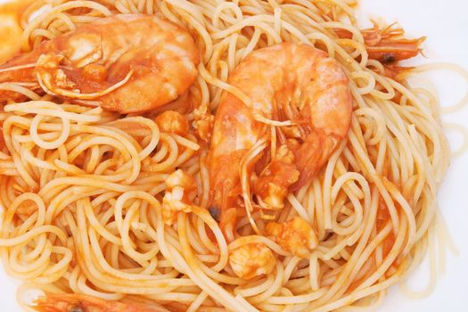 detail of spaghetti with shrimps and tomato sauce isolated on white background