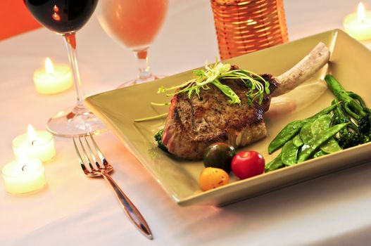 Gourmet romantic dinner with red wine at candlelight