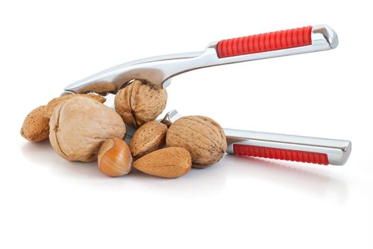 detail of nutcracker with almonds and nuts isolated on white background
