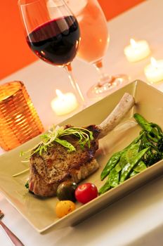 Gourmet romantic dinner with red wine at candlelight