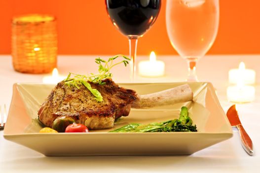 Gourmet romantic dinner with red wine at candlelight