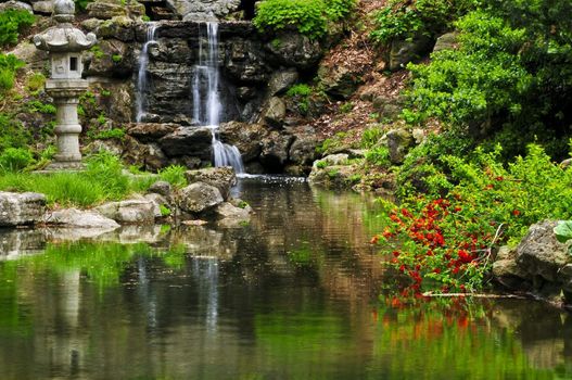 Cascading waterfall and pond in japanese garden