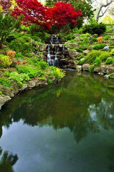 Cascading waterfall and pond in japanese garden