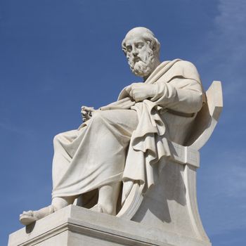 Neoclassical statue of ancient Greek philosopher, Plato, in front of the Academy of Athens in Greece.