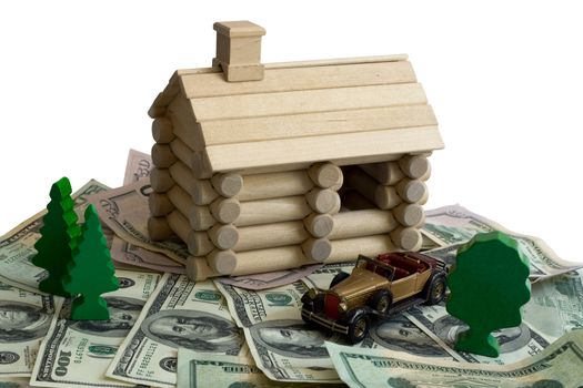 Miniature Log House building model and money dollar bills background