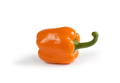Isolated sweet Orange bell pepper (Capsicum annuum) with shadow on white background. Clipping path included to remove object shadow or replace background.