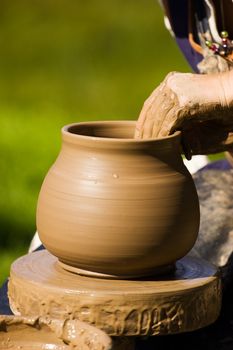 Potters hands working on new pot