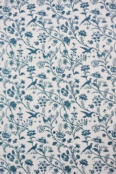 White and blue victorian wallpaper depicting flowers and birds. Suitable as a background.