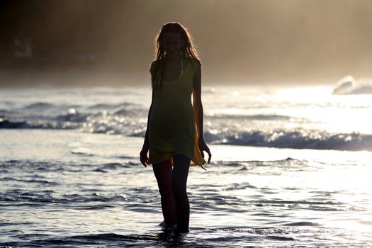 woman silhouette by sunset in the caribbean