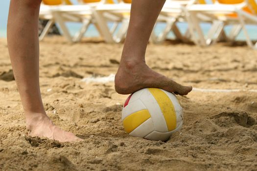 playing soccer with volleyball on the beach