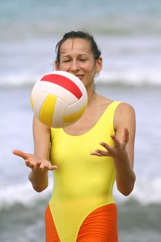 Woman in yellow leotard doing stretching exercises