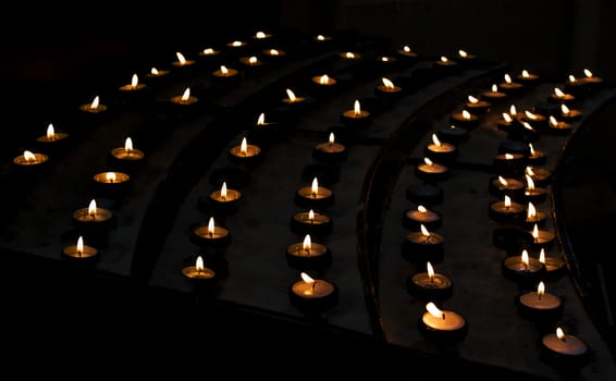 Lighted candles in church.
