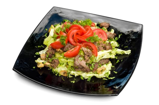 black square dish with fresh vegetables and roasted meat salad, isolated on white