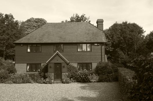 A nice home in the countryside, toned to look like an antique photo