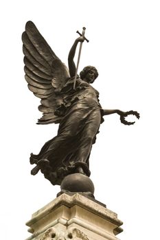 Winged statue of Victory in Colchester War Memorial. In her right hand she is holding a sword, point downwards so that it represents "The Cross of Sacrifice" and "The Sword of Devotion," and in her left a wreath of laurel. 