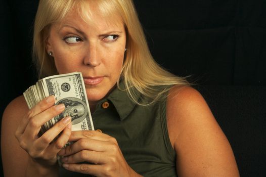 Attractive Woman Gets Greedy About Her Stack of Money