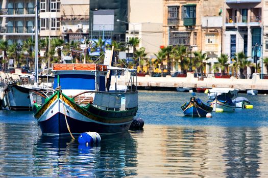 Maltese boats in a bay during summer day